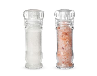 Image of Different salt in glass mill and shaker isolated on white