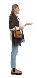 Full length portrait of senior woman with bag on white background