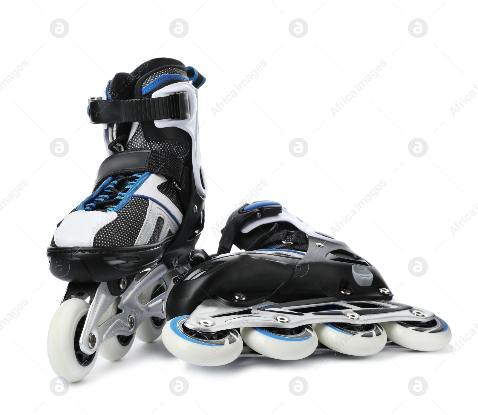 Photo of Pair of inline roller skates on white background