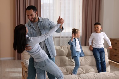 Photo of Happy international family spending time together at home