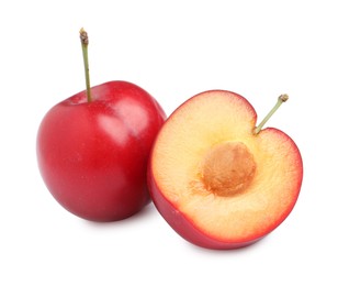 Photo of Cut and whole cherry plums on white background