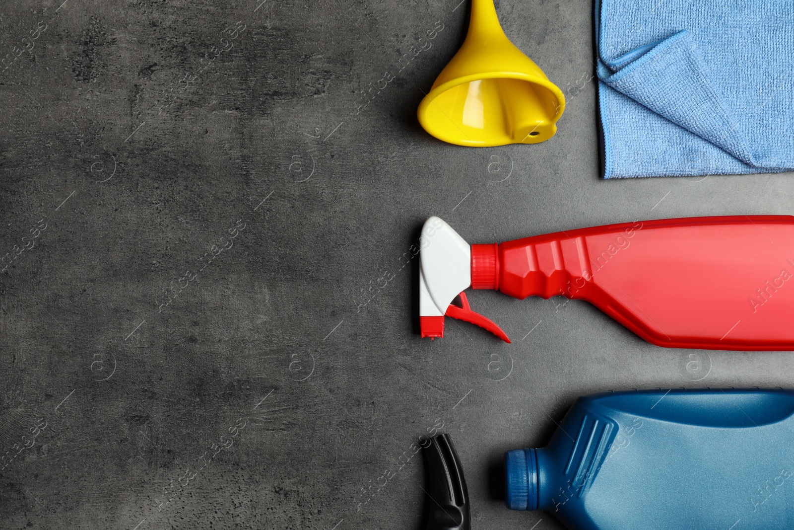 Photo of Different car cleaning products on dark background, flat lay. Space for text