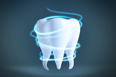 Image of Tooth model with glowing on color background. Dental care