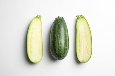 Photo of Fresh ripe green zucchinis on white background, top view