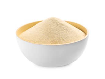 Uncooked organic semolina in bowl isolated on white