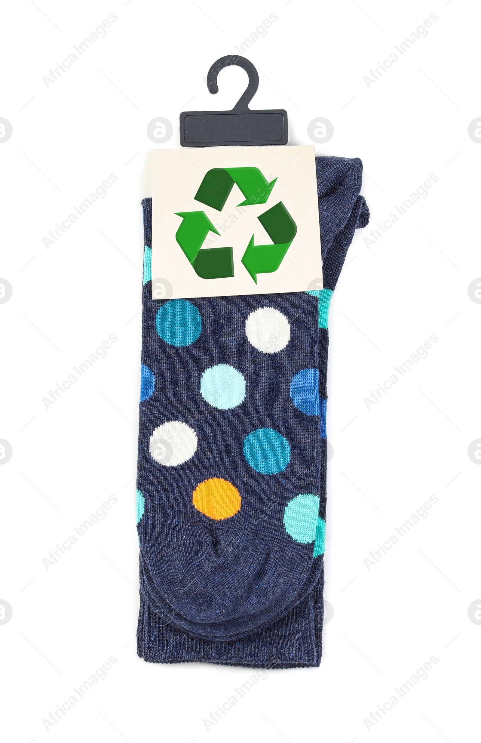 Image of Colorful socks with recycling label on white background, top view