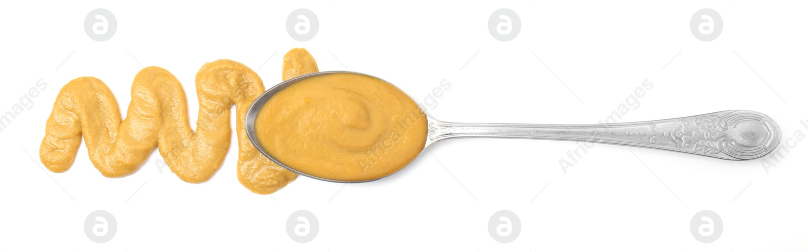 Photo of Tasty mustard sauce and spoon isolated on white, top view