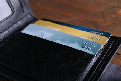 Credit cards in leather wallet on table, closeup