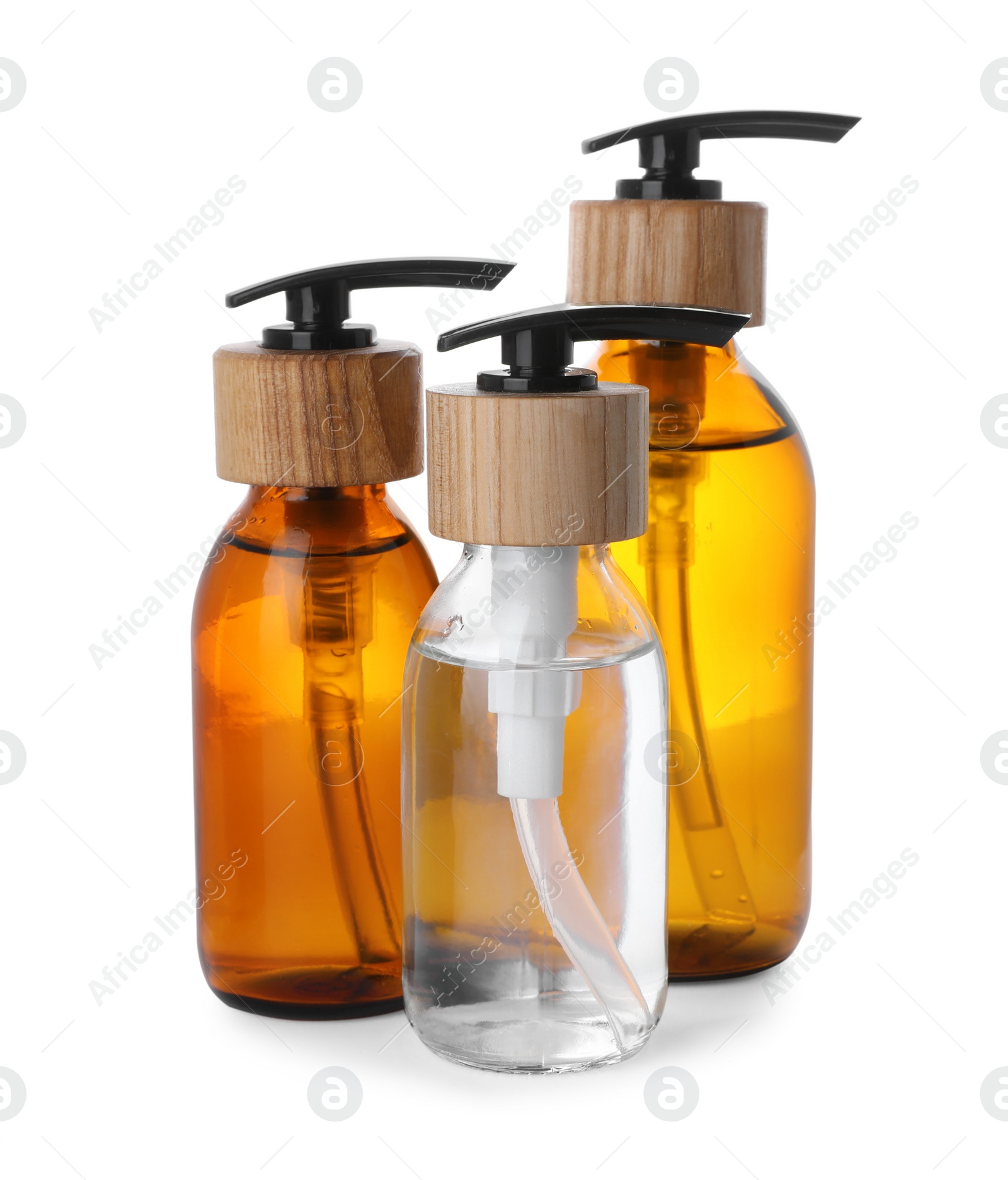 Photo of Bottles with dispenser caps on white background