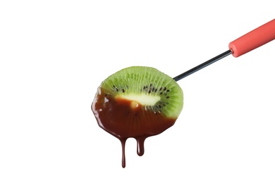 Photo of Fork with kiwi slice dipped into chocolate fondue on white background