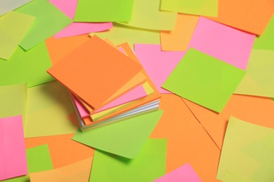 Photo of Many colorful stickers as background. Office stationery