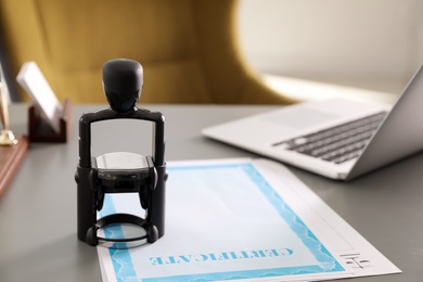 Photo of Automatic stamp and documents on desk in notary's office with space for text