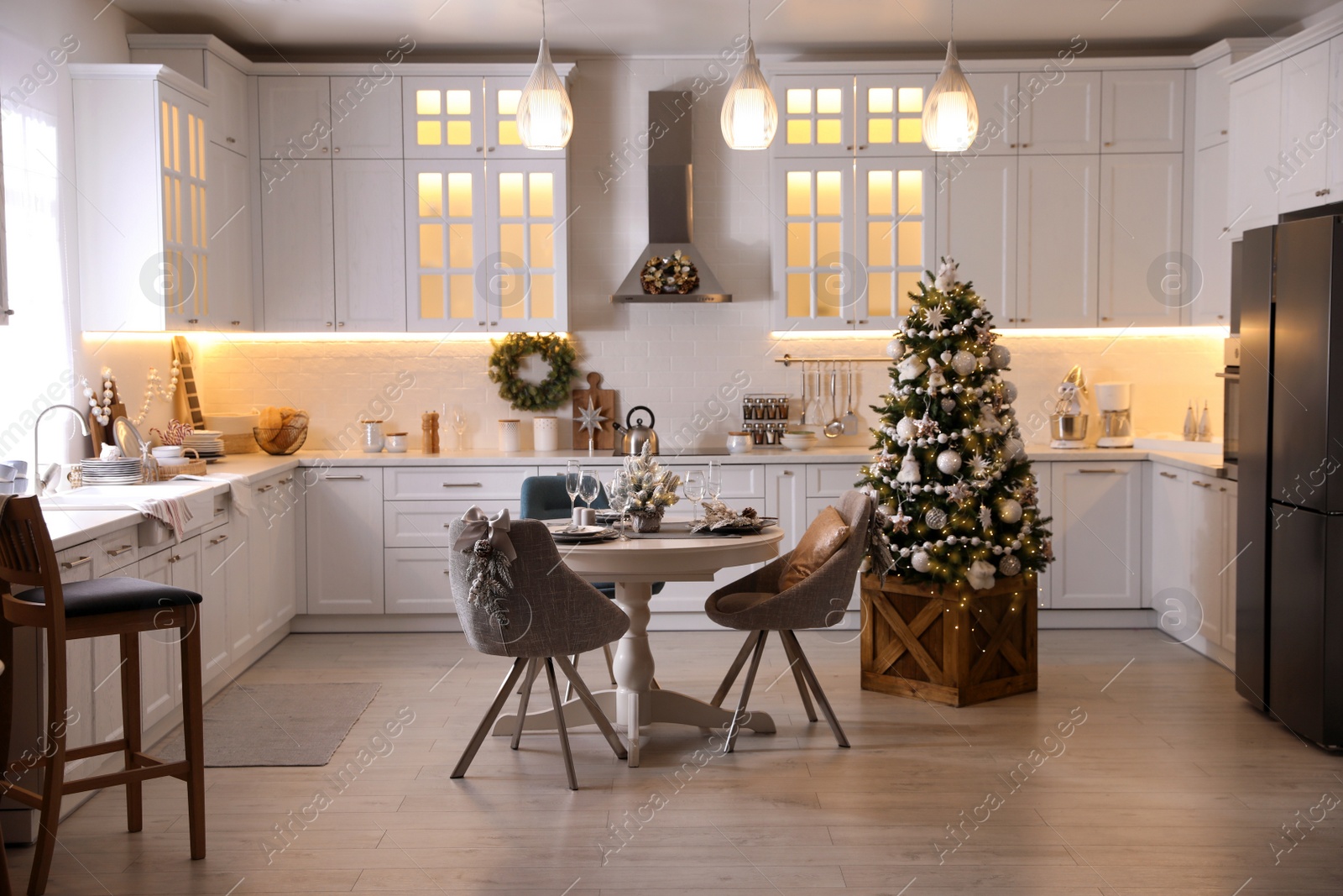 Photo of Stylish kitchen interior with beautiful Christmas decor