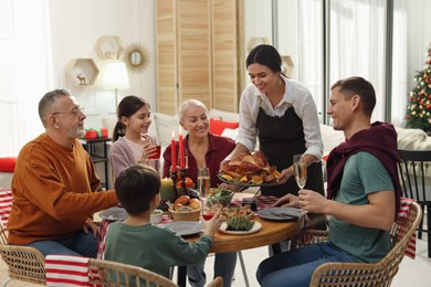 Happy family enjoying festive dinner at home. Christmas celebration