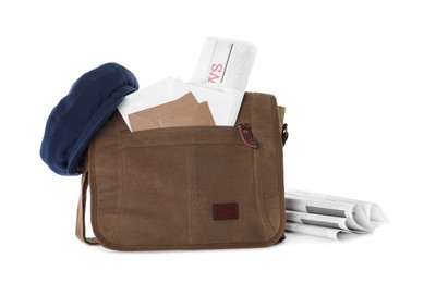 Photo of Brown postman bag with mails, newspapers and hat on white background