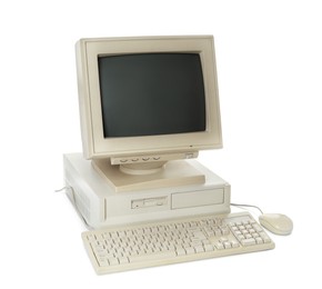 Photo of Old computer monitor, system unit, keyboard and mouse on white background