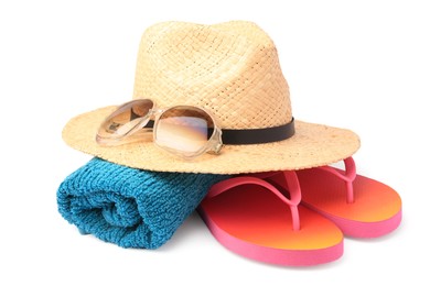Photo of Straw hat, towel, sunglasses and flip flops isolated on white. Beach objects