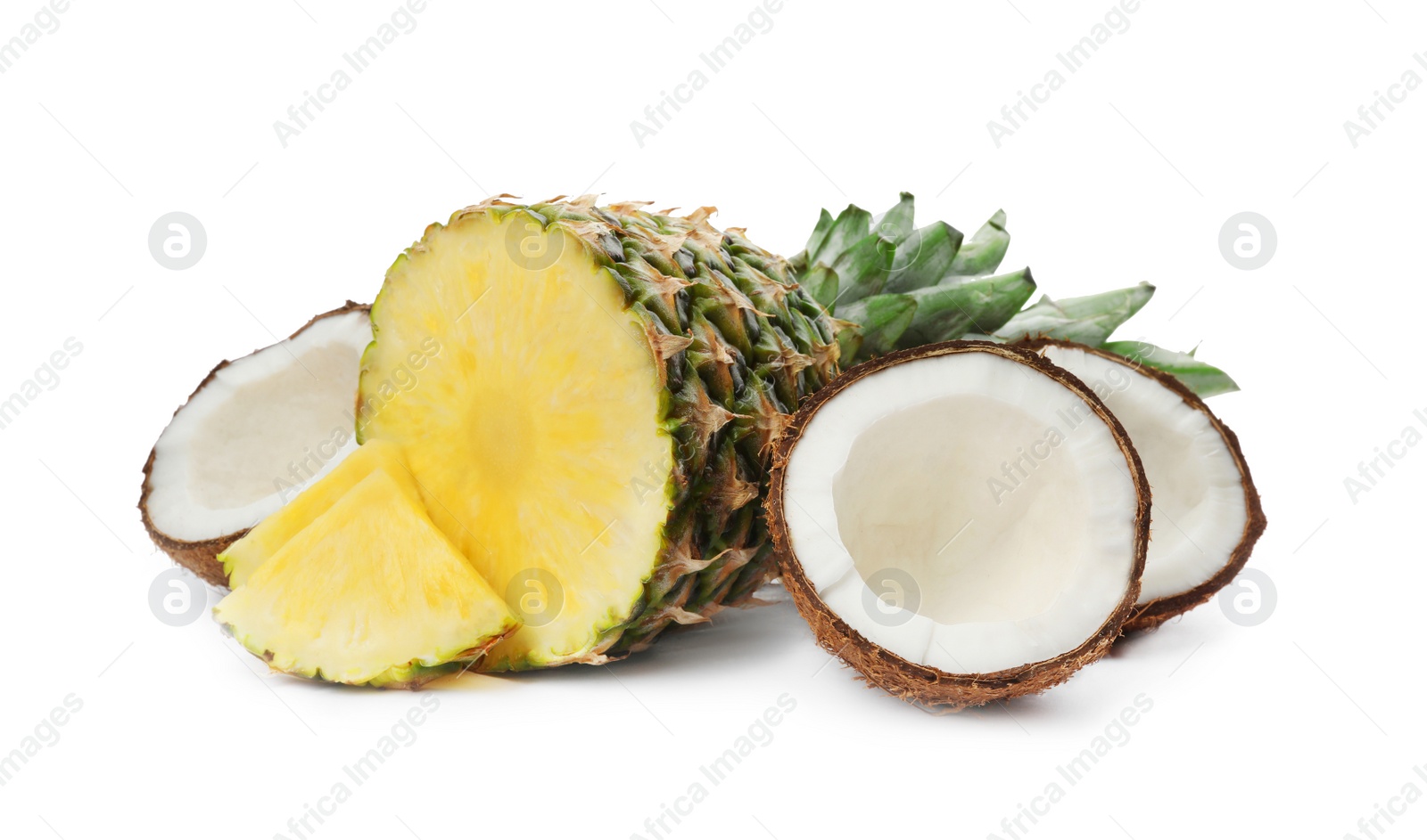 Photo of Tasty raw cut pineapple and coconuts on white background