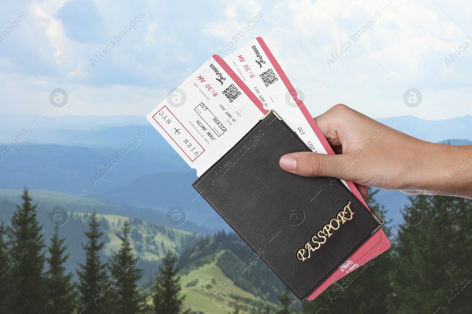 Image of Woman holding passport with tickets in mountains, closeup. Travel agency service