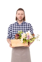 Photo of Male florist holding basket with flowers on white background