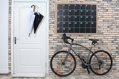 Photo of Modern bicycle in stylish hallway interior