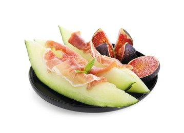 Photo of Plate with tasty melon, jamon and figs isolated on white
