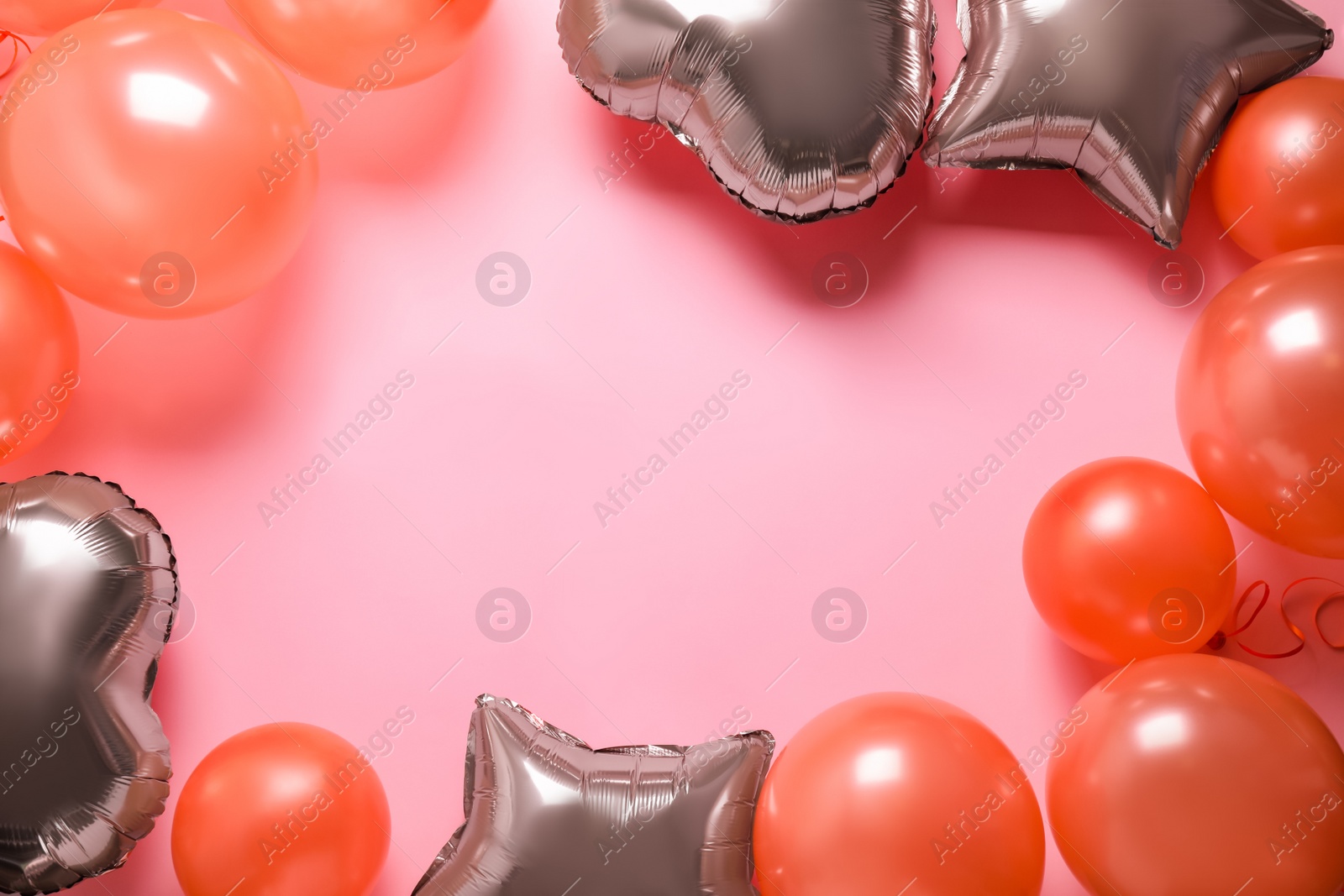 Photo of Colorful balloons on pink background, flat lay. Space for text