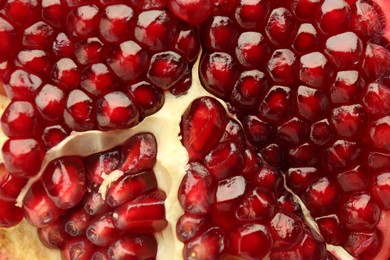 Ripe juicy pomegranate grains as background, closeup