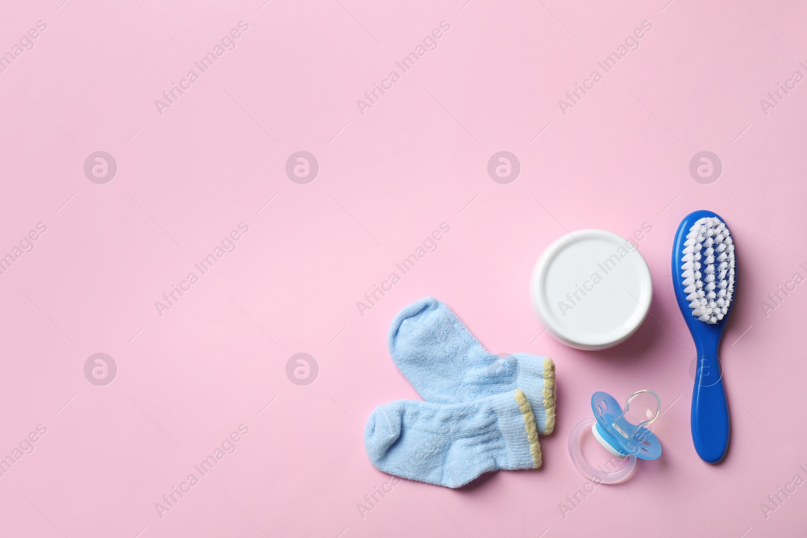 Photo of Flat lay composition with baby accessories on color background. Space for text