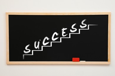 Stairs with word Success drawn on chalkboard against white background. Career promotion concept