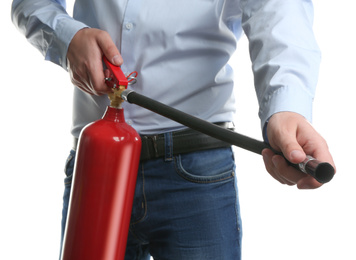 Photo of Man using fire extinguisher on white background, closeup