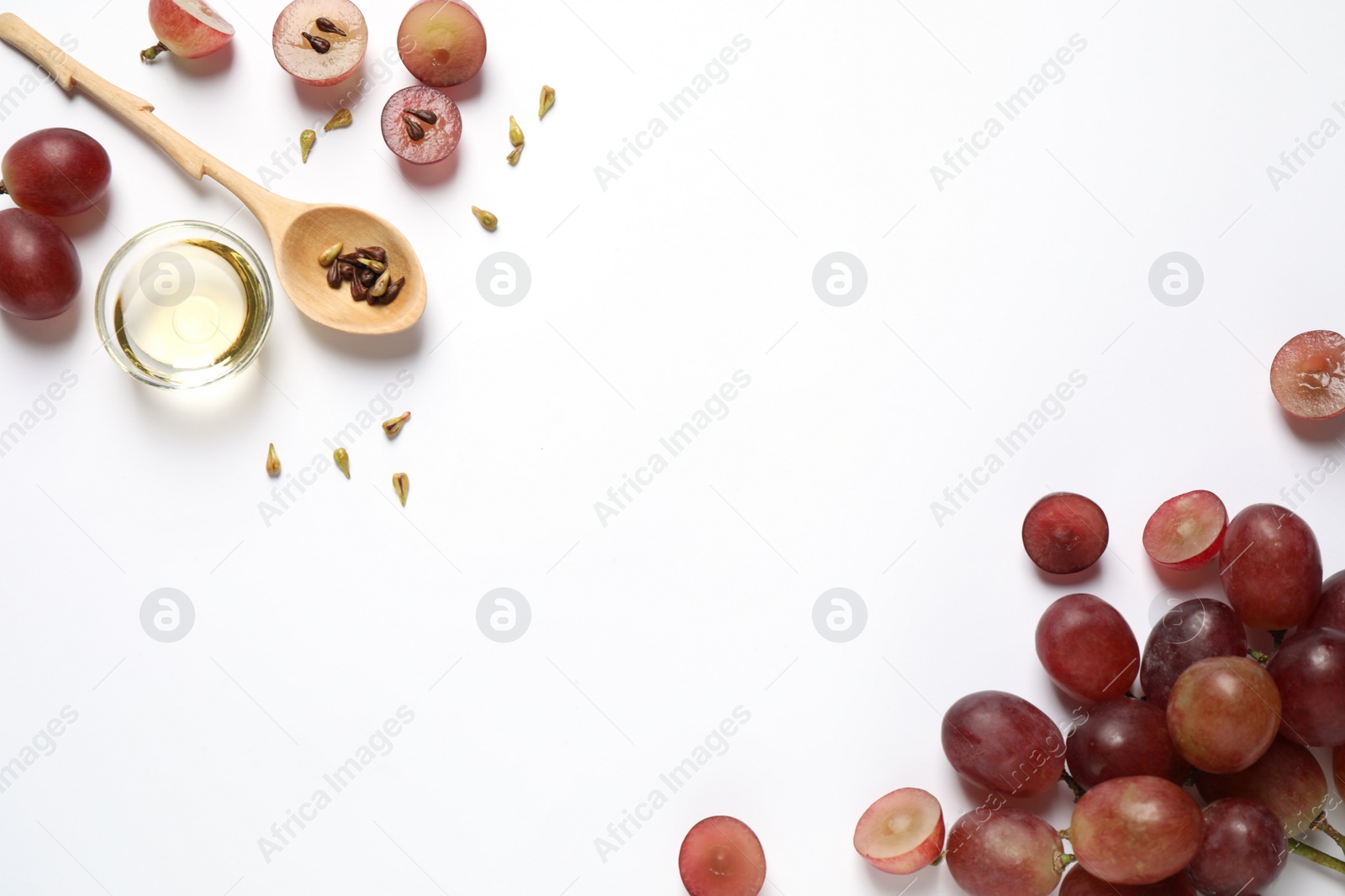 Photo of Composition with natural grape seed oil on white background, top view. Organic cosmetic