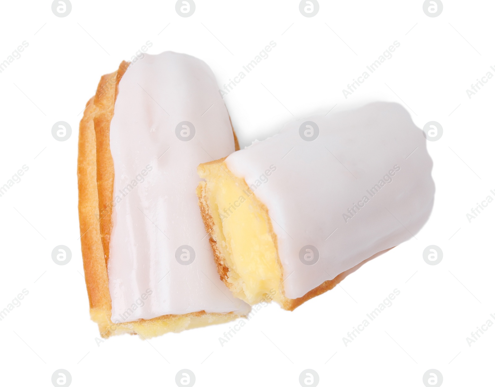 Photo of Cut delicious eclair covered with glaze isolated on white, top view