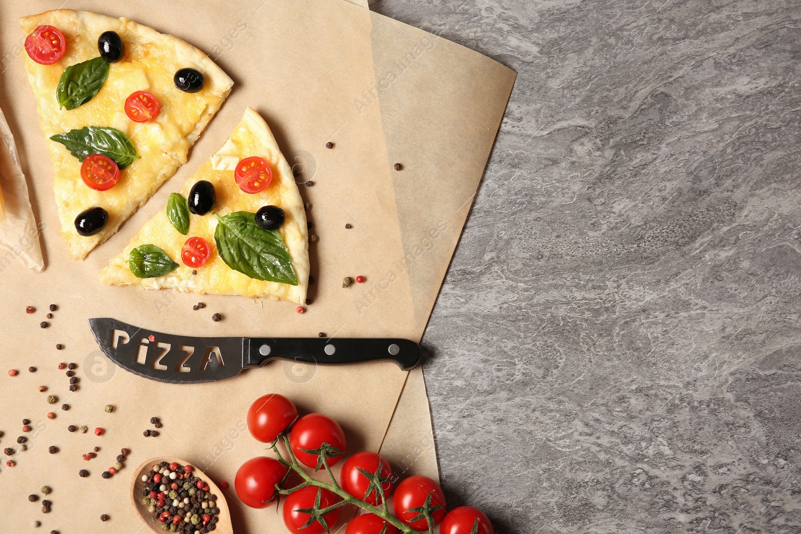 Photo of Flat lay composition with slices of tasty homemade pizza and space for text on table