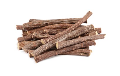 Photo of Dried sticks of liquorice root on white background