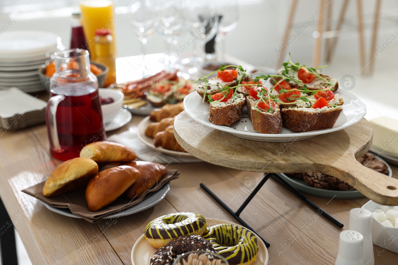 Photo of Brunch table setting with different delicious food indoors