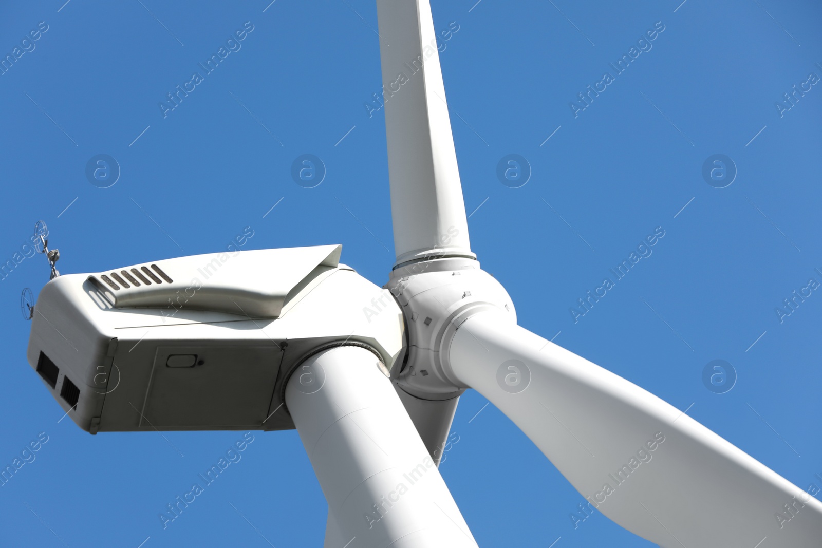 Photo of Wind turbine against beautiful sky, closeup. Alternative energy source