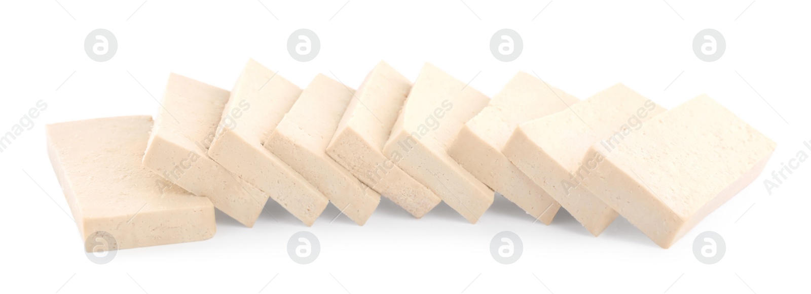 Photo of Slices of delicious raw tofu on white background