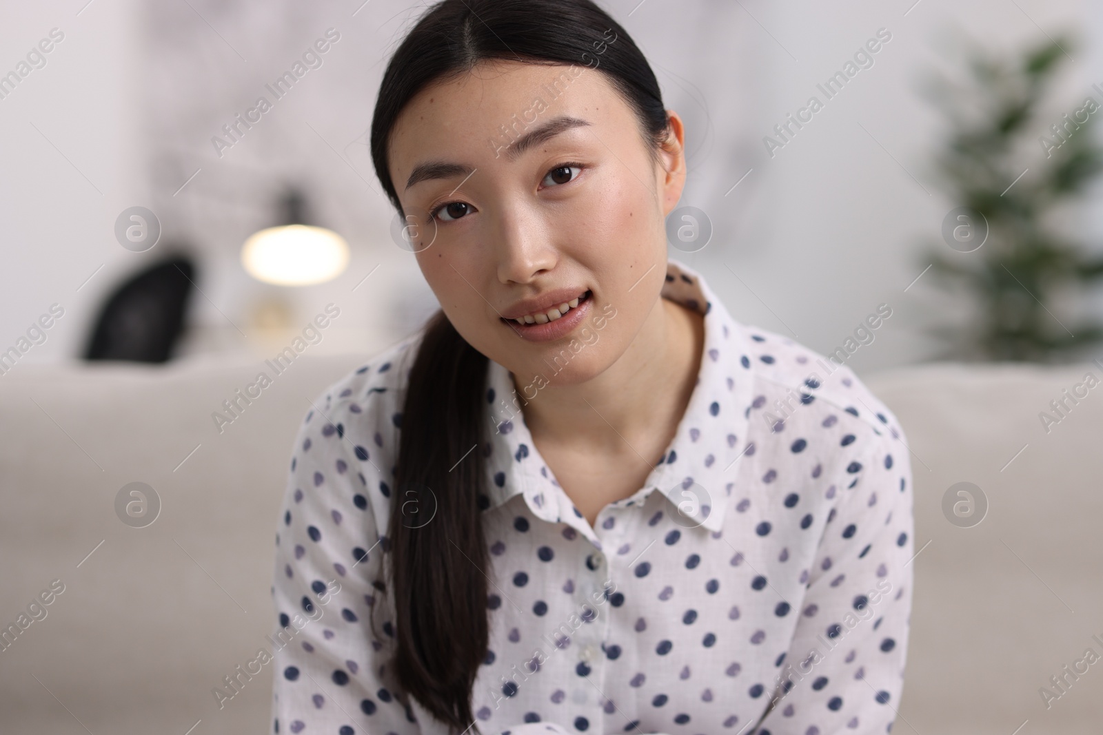 Photo of Portrait of smiling businesswoman wearing shirt in office