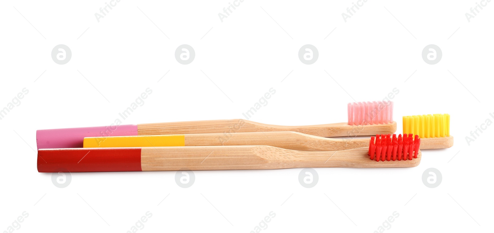 Photo of Natural bamboo toothbrushes with soft bristles isolated on white