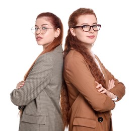 Photo of Portrait of beautiful young redhead sisters on white background