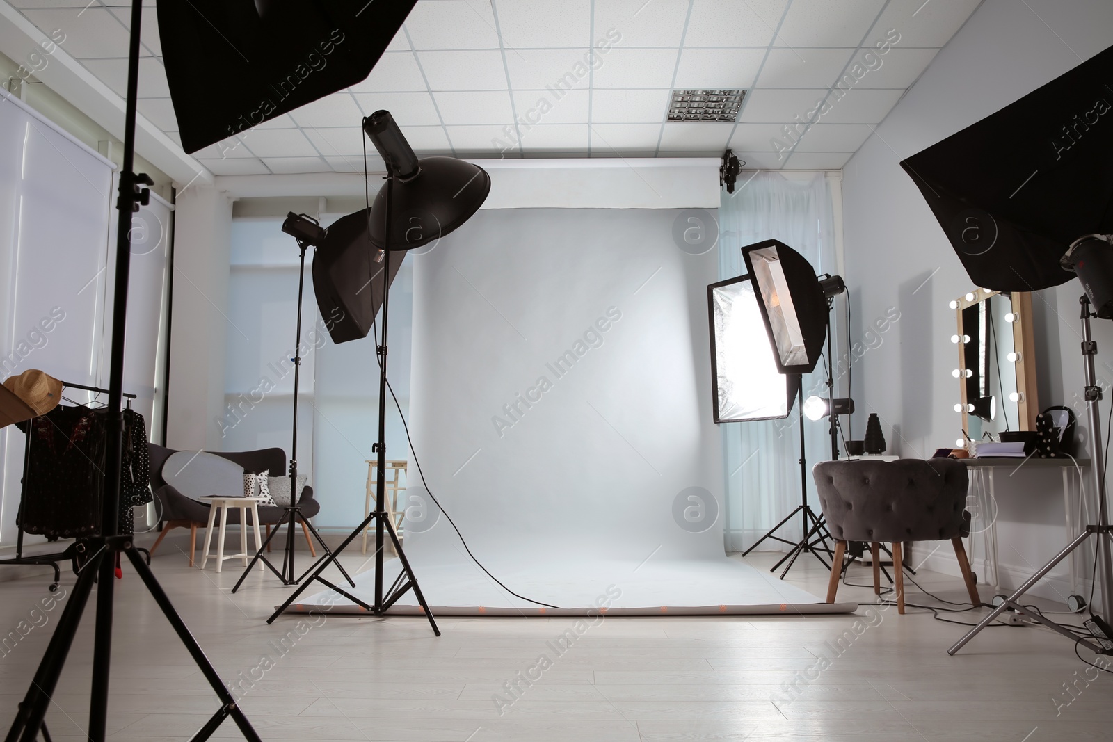 Photo of Interior of modern photo studio with professional equipment