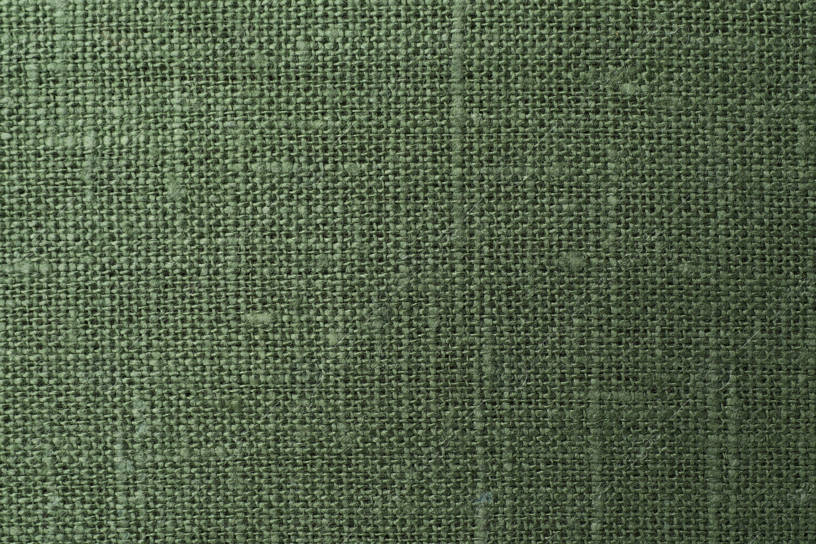 Photo of Texture of green fabric as background, top view