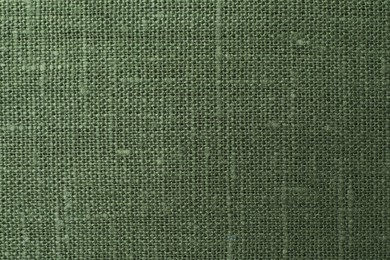 Texture of green fabric as background, top view