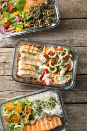 Healthy meal. Containers with different products on wooden table, flat lay