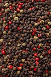 Aromatic peppercorn mix as background, top view