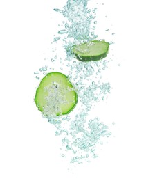 Fresh cucumber slices in water on white background