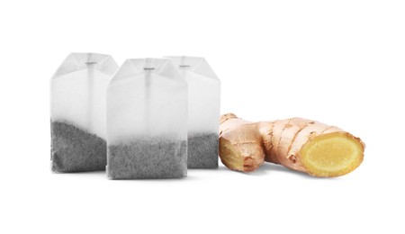 Tea bags and ginger on white background