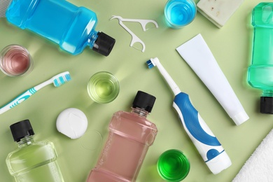 Photo of Flat lay composition with oral care products on color background. Teeth hygiene