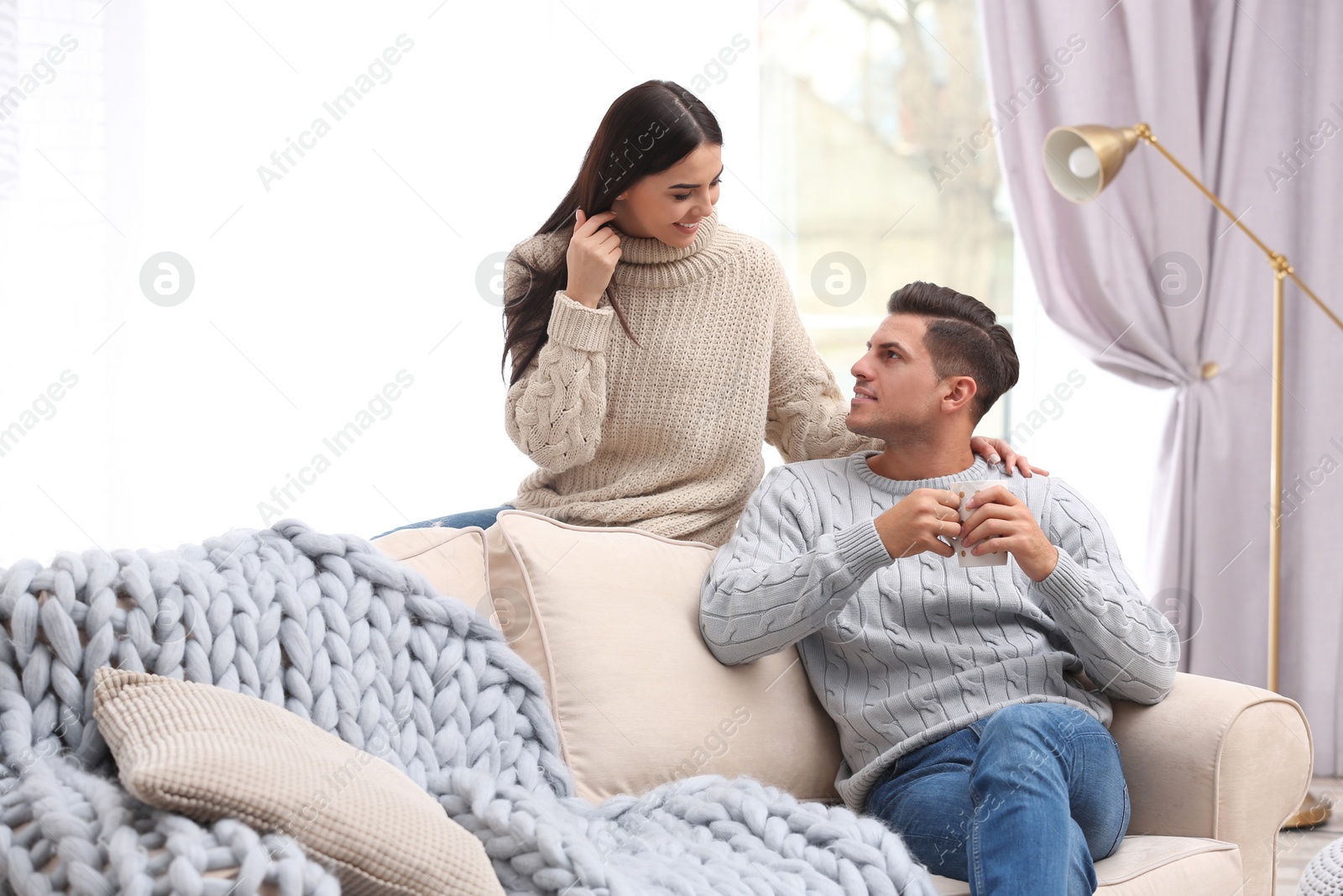 Photo of Happy couple spending time together at home. Winter vacation